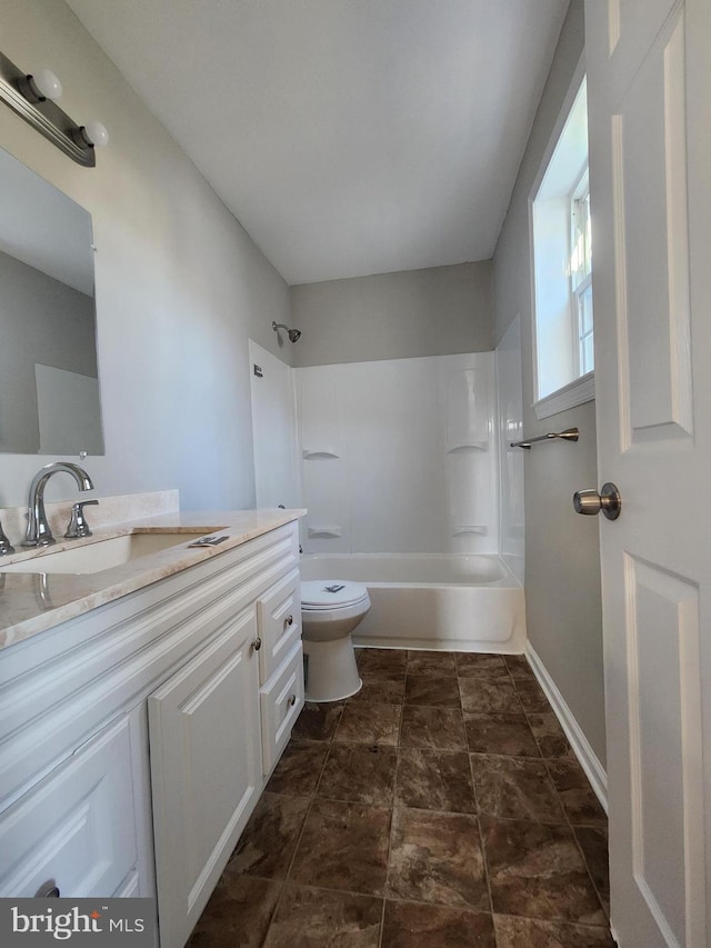 full bathroom with vanity, toilet, and washtub / shower combination