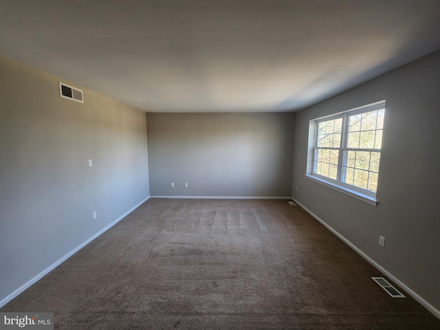 empty room featuring carpet flooring