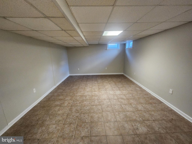 basement featuring a drop ceiling