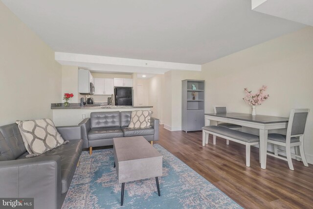 living room featuring dark wood-type flooring