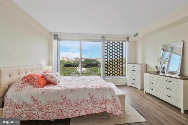 bedroom with wood-type flooring