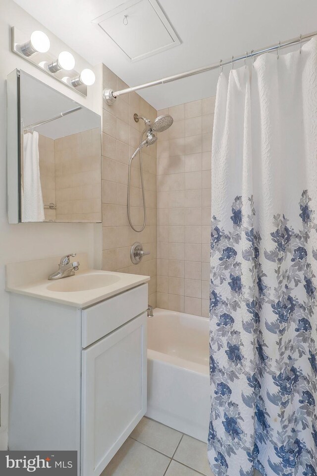 bathroom with vanity, tile patterned flooring, and shower / bath combo with shower curtain