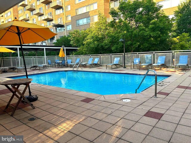 view of pool featuring a patio