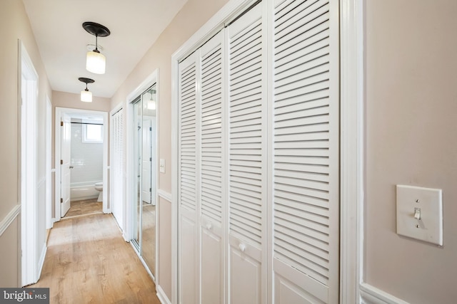 hall with light wood-type flooring