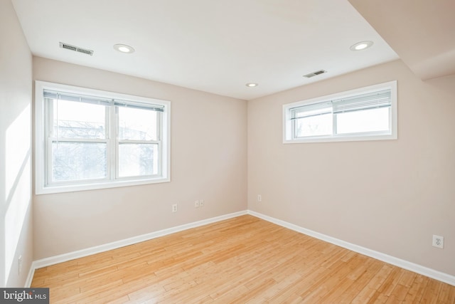 spare room featuring light wood-type flooring