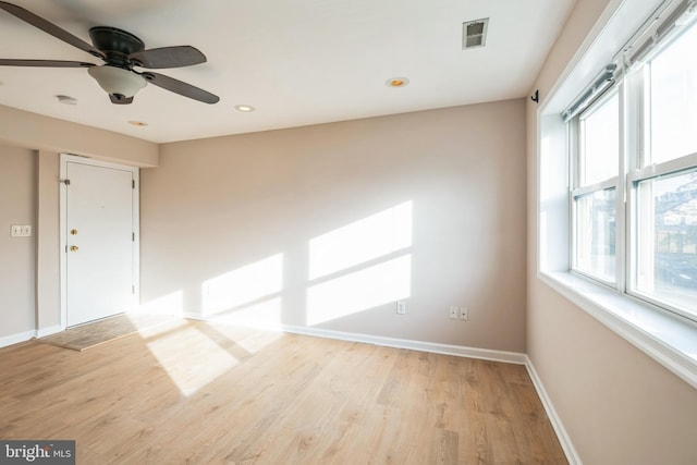 unfurnished room with ceiling fan and light hardwood / wood-style floors