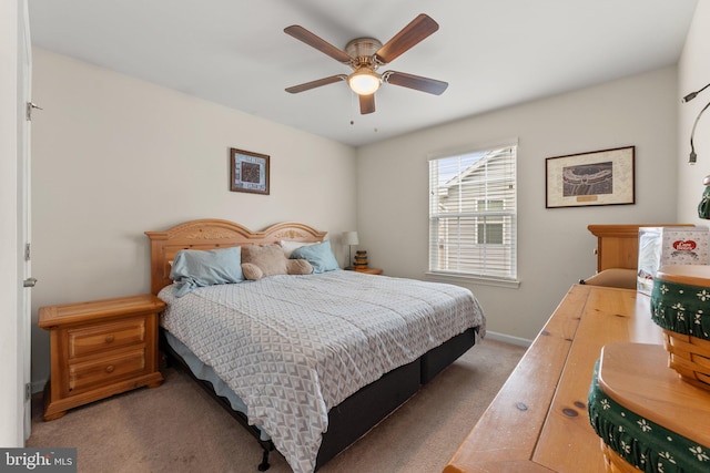 bedroom with ceiling fan and carpet floors