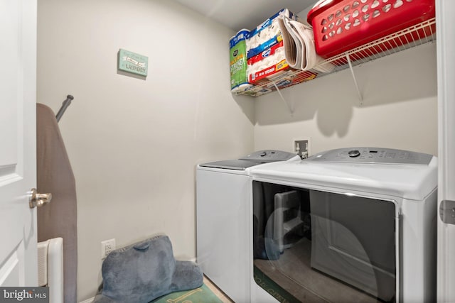 clothes washing area with radiator heating unit and washing machine and clothes dryer