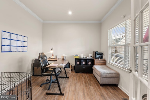 home office featuring ornamental molding and hardwood / wood-style floors