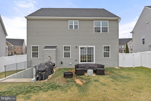 rear view of property with an outdoor living space and a lawn