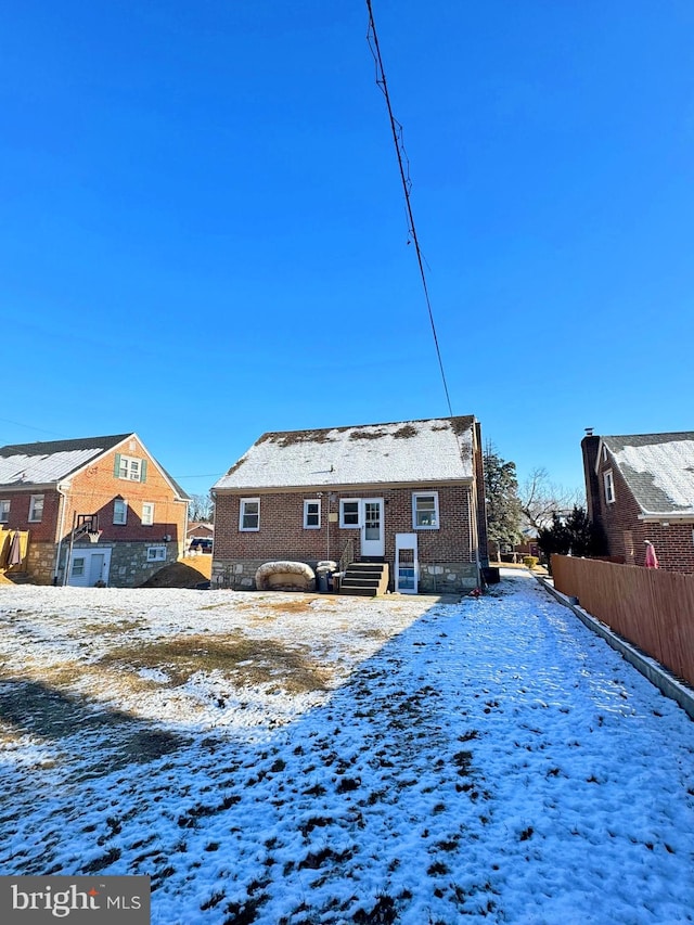 view of snow covered house