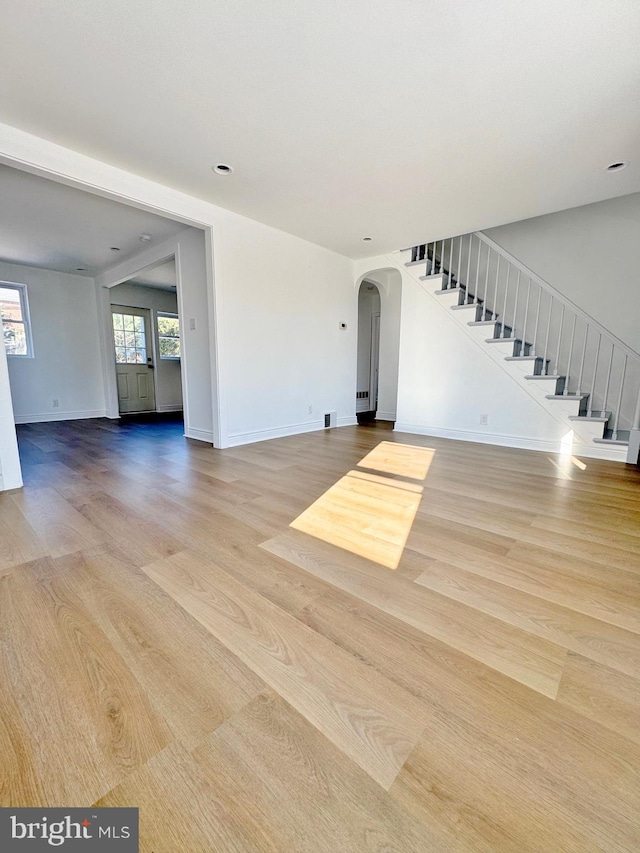 unfurnished living room with light hardwood / wood-style flooring