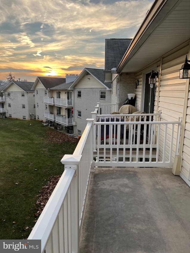 view of balcony at dusk