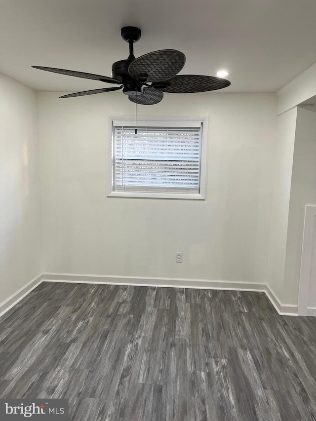 unfurnished room featuring ceiling fan and dark hardwood / wood-style floors