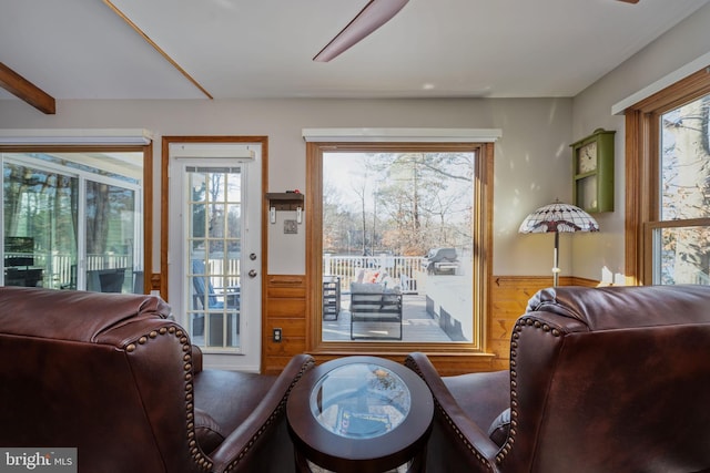 interior space featuring wooden walls and a healthy amount of sunlight