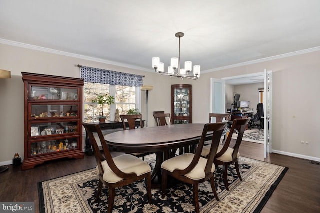 dining space with ornamental molding, dark hardwood / wood-style floors, and an inviting chandelier