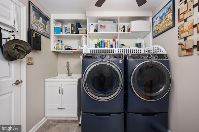 clothes washing area with ceiling fan, sink, and washing machine and clothes dryer