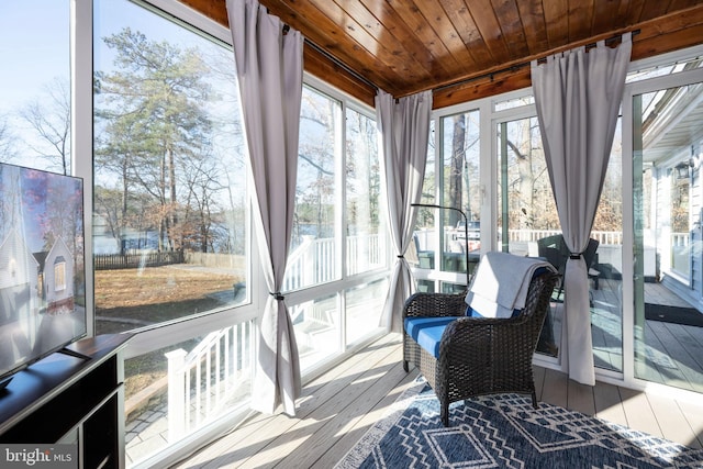 sunroom featuring wooden ceiling