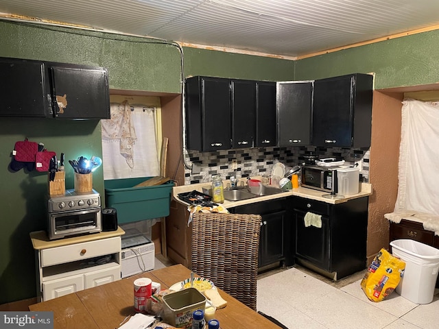 kitchen with decorative backsplash and sink