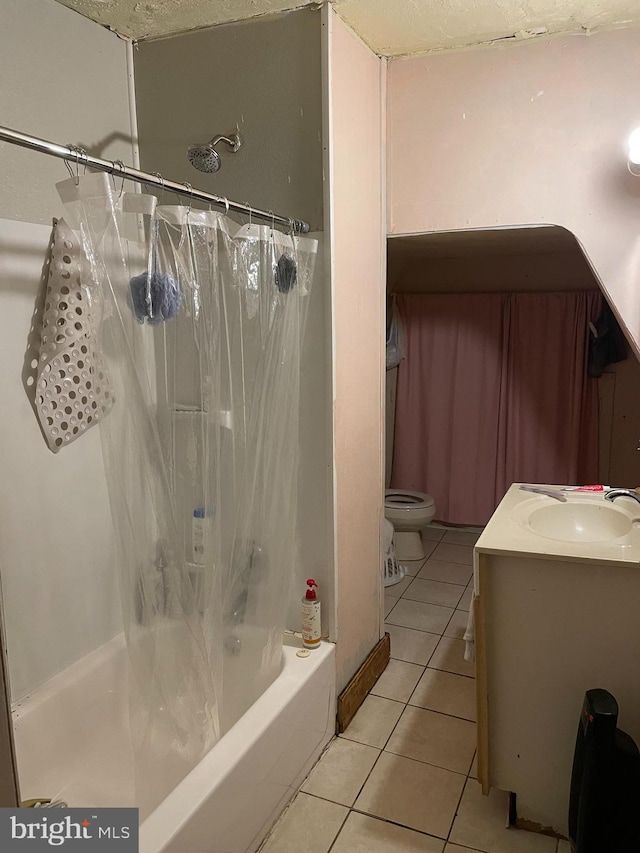 full bathroom featuring toilet, shower / tub combo, vanity, and tile patterned floors