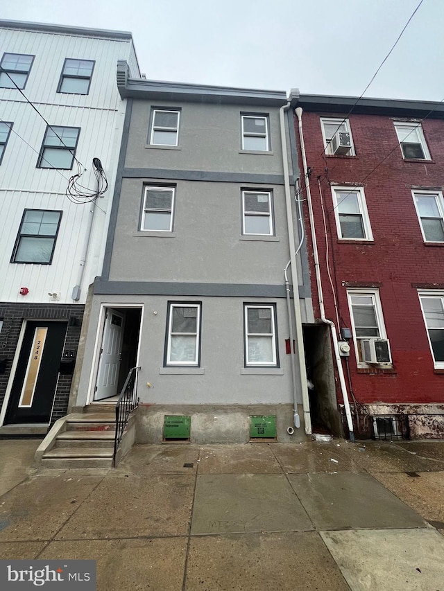 view of front of house featuring stucco siding