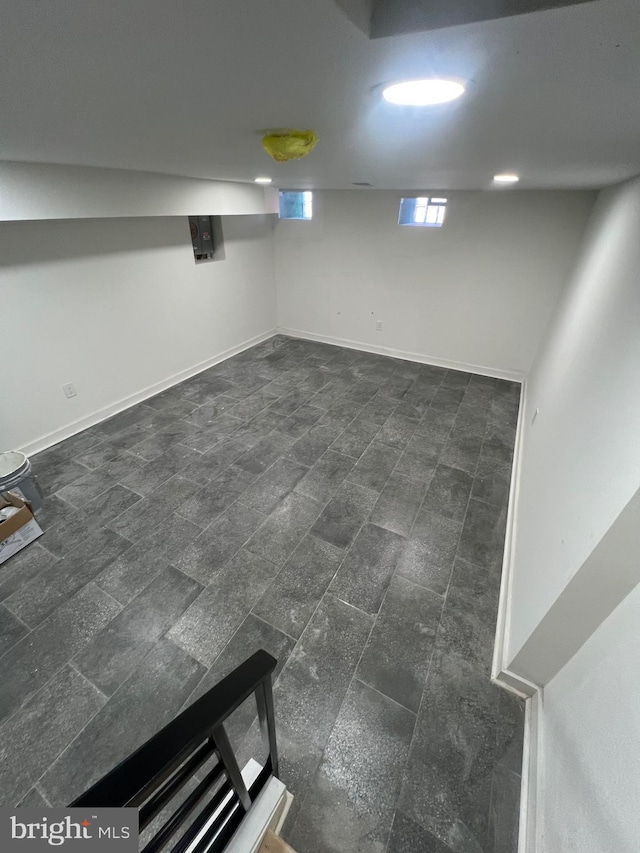 basement featuring baseboards