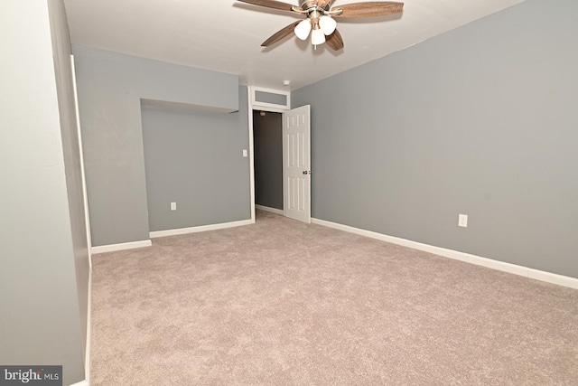 unfurnished bedroom with light colored carpet and ceiling fan