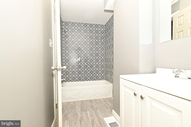 bathroom featuring vanity and bathing tub / shower combination