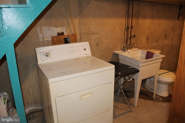 laundry area featuring washer / clothes dryer and sink