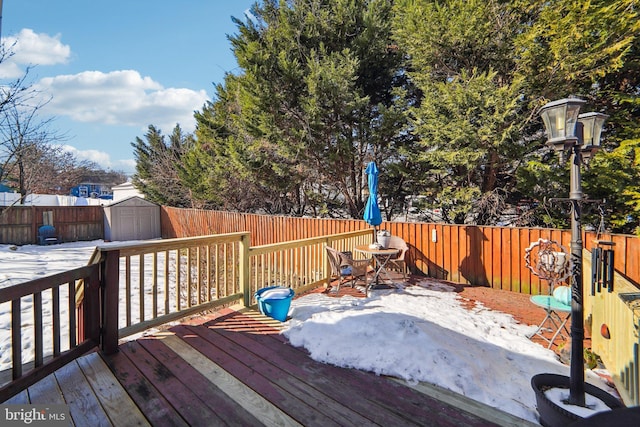 wooden deck with a storage shed