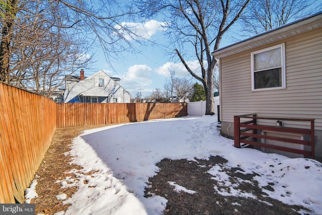 view of yard layered in snow