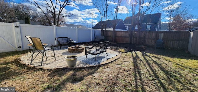 view of yard with a patio and an outdoor fire pit