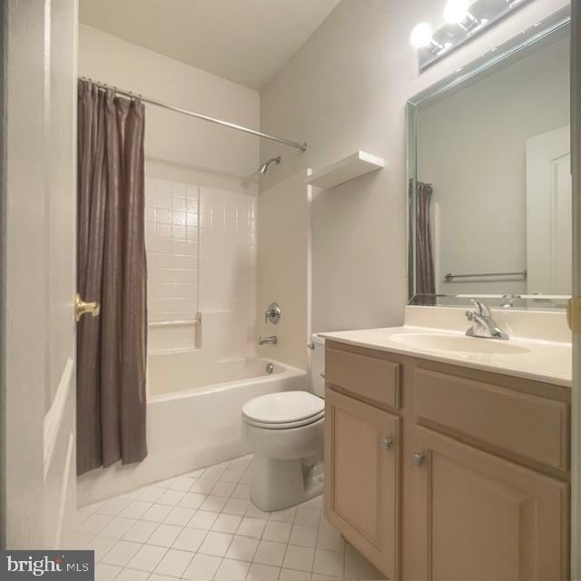 full bathroom with tile patterned flooring, shower / bath combo, toilet, and vanity