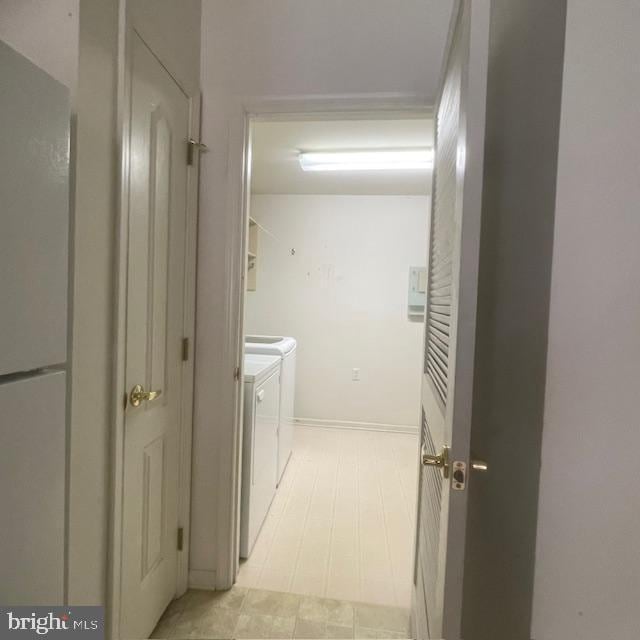 clothes washing area featuring washing machine and clothes dryer