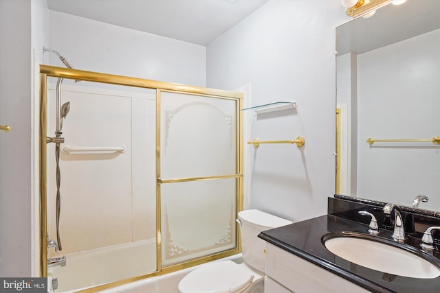 full bathroom with vanity, enclosed tub / shower combo, and toilet