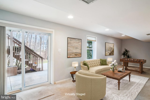 carpeted living room with plenty of natural light