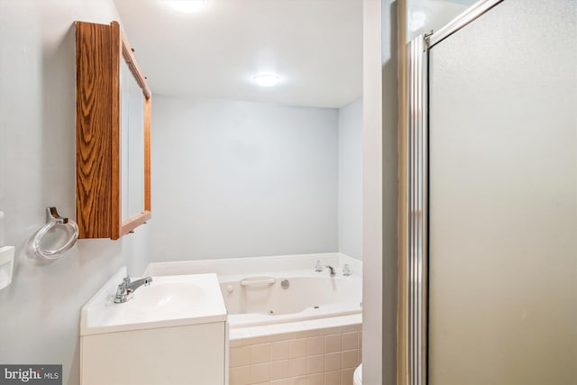 bathroom with plus walk in shower and vanity