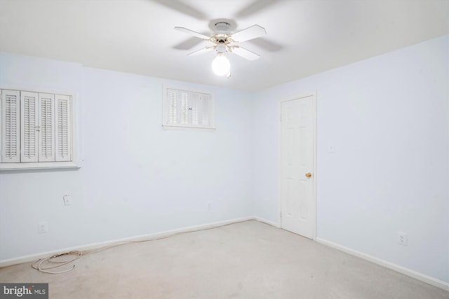 carpeted empty room with ceiling fan