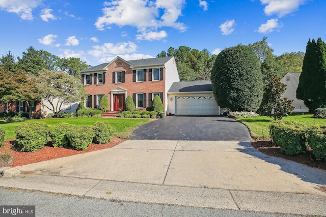 colonial-style house featuring a garage