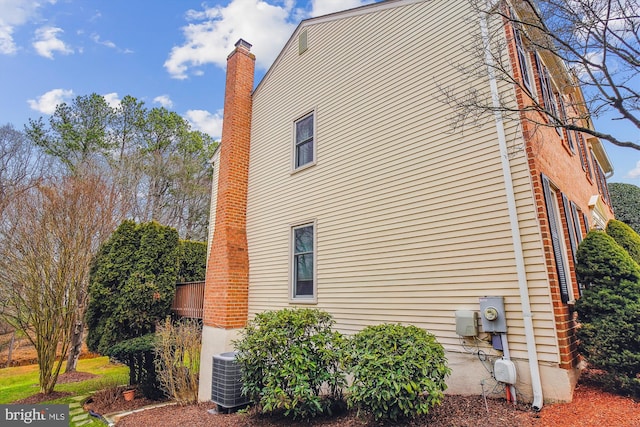 view of side of home with cooling unit