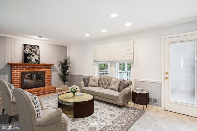 carpeted living room featuring wooden walls, a brick fireplace, and ornamental molding