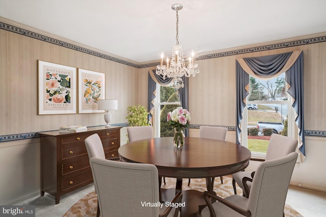 dining area featuring light colored carpet, an inviting chandelier, and a healthy amount of sunlight