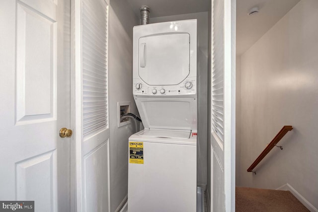 laundry room featuring stacked washer and dryer