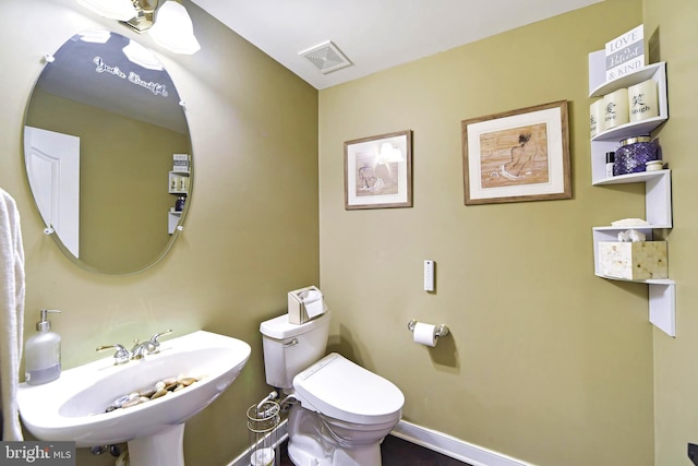 bathroom featuring sink and toilet