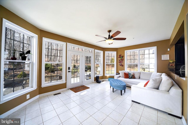 interior space featuring ceiling fan and light tile patterned floors