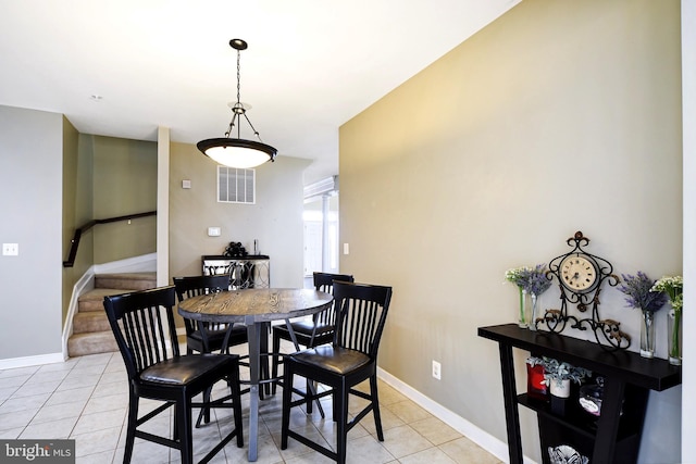 dining space with light tile patterned floors