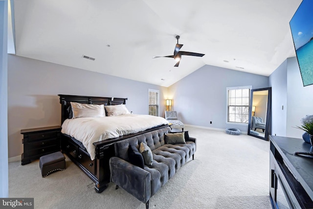 carpeted bedroom with ceiling fan and lofted ceiling