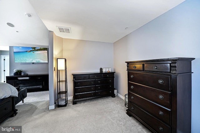 bedroom with light carpet