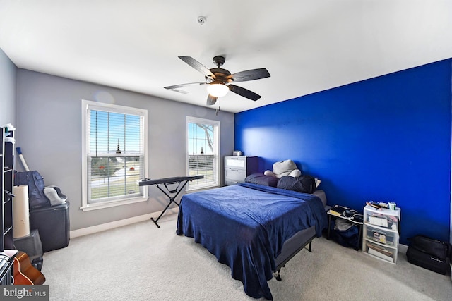 carpeted bedroom featuring ceiling fan