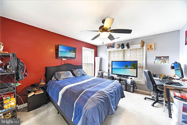 bedroom featuring light colored carpet and ceiling fan